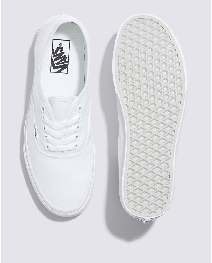 Vans Authentic low-top sneakers in a classic canvas design, featuring sturdy uppers in seasonal colors. The iconic rubber waffle outsole and lace-up closure provide a timeless look for creative and casual styles. True White color and Top and bottom angle view.