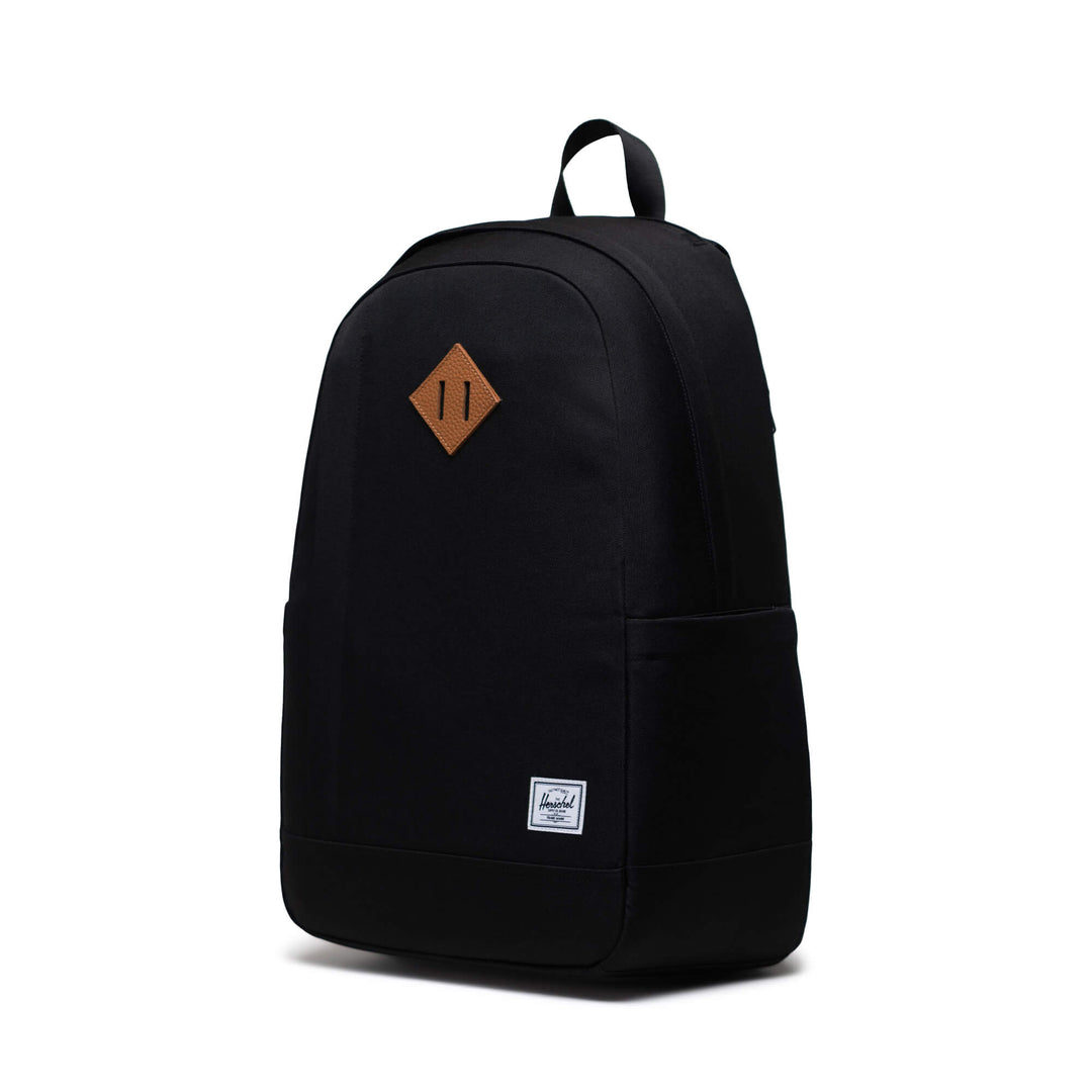 A black backpack on a white background