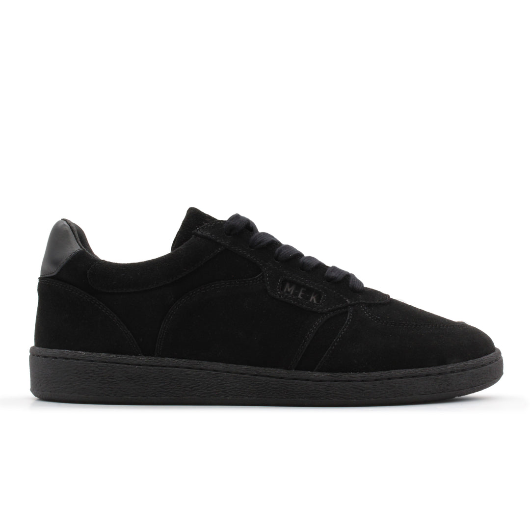 A black low top sneaker with a black sole.