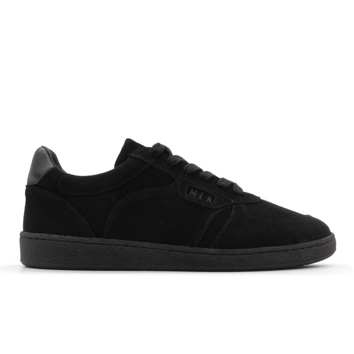 A black low top sneaker with a black sole.