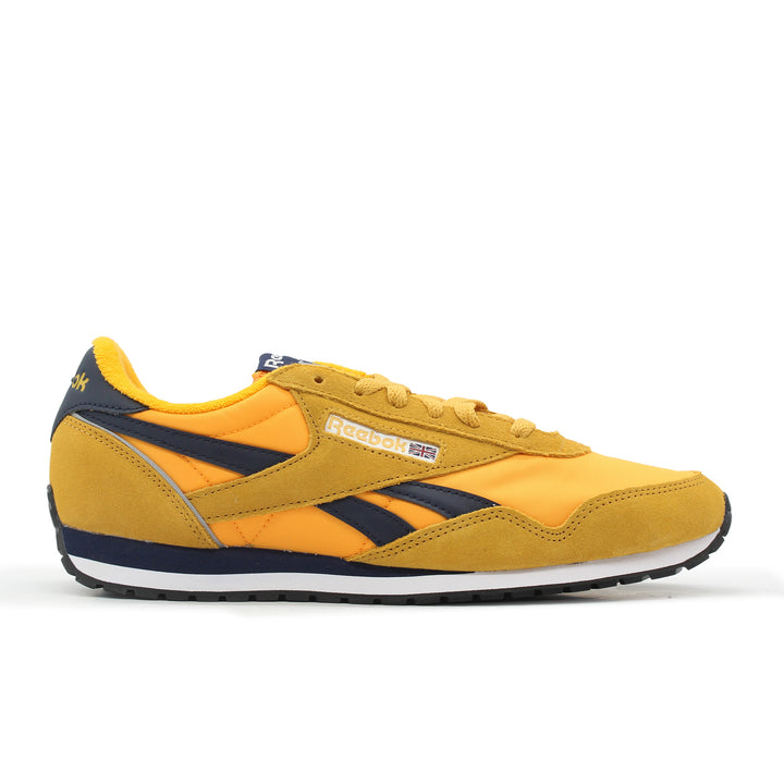 Yellow sneaker with navy accents on a white background