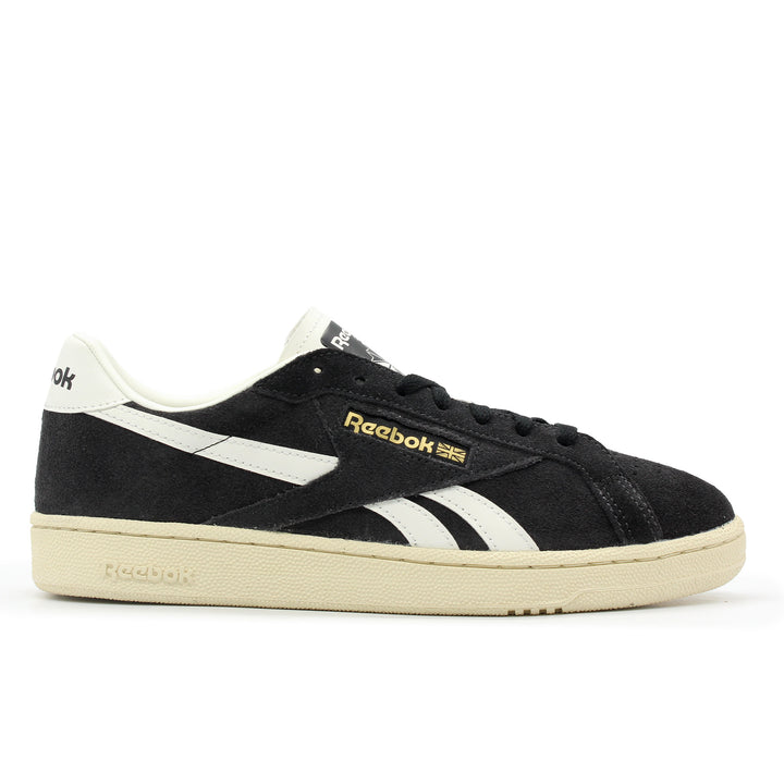 Black Reebok sneaker with white accents on a white background