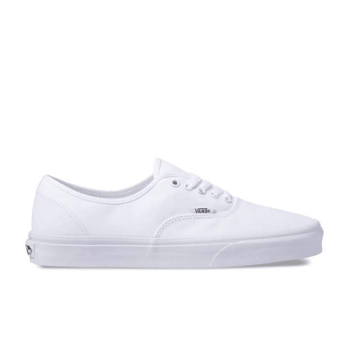Vans Authentic low-top sneakers in a classic canvas design, featuring sturdy uppers in seasonal colors. The iconic rubber waffle outsole and lace-up closure provide a timeless look for creative and casual styles. True White color and Right facing angle view.