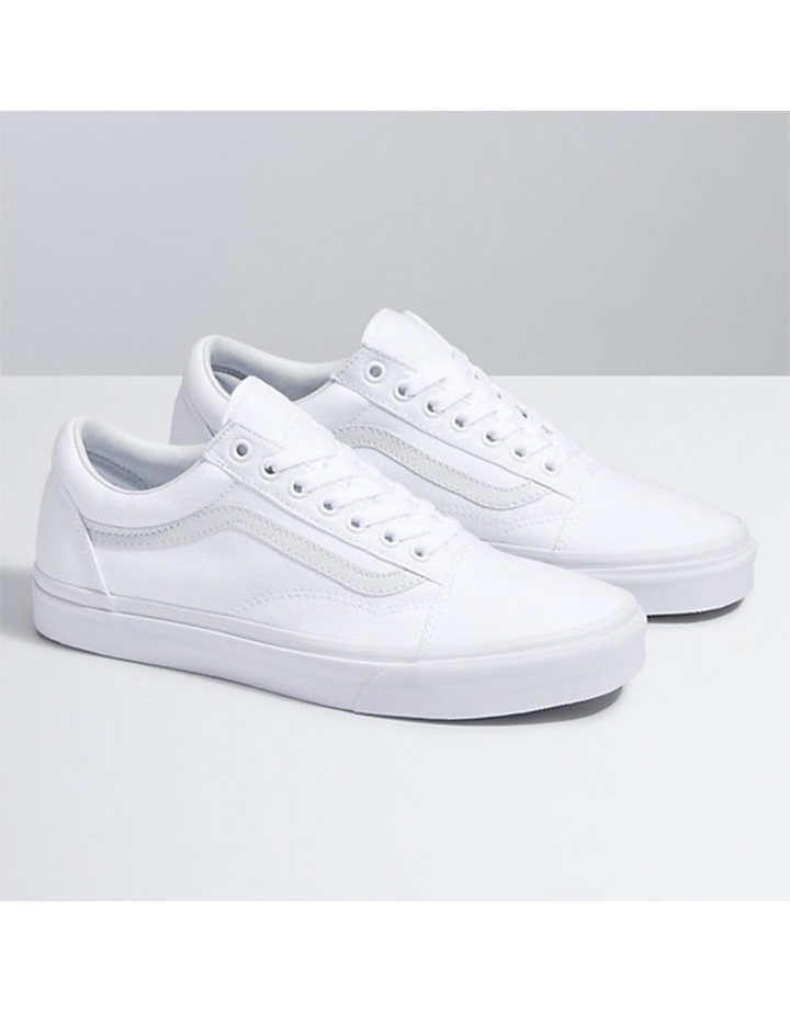 Vans Old Skool Canvas Shoes - Iconic Sidestripe Low-Top Design with Durable Construction and Signature Rubber Waffle Outsoles. True white color and side view.