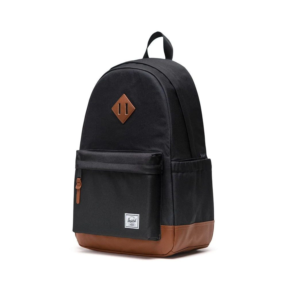 Black backpack with brown accents on a white background