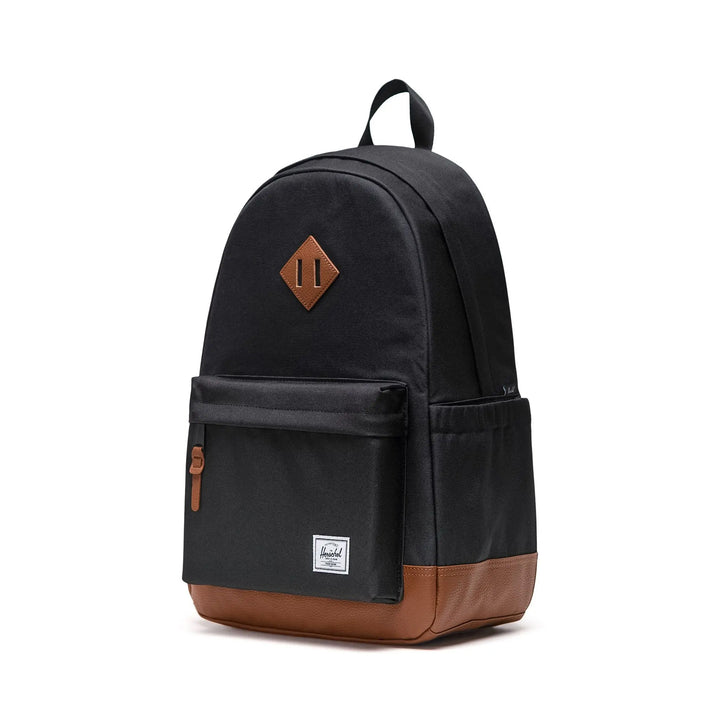 Black backpack with brown accents on a white background