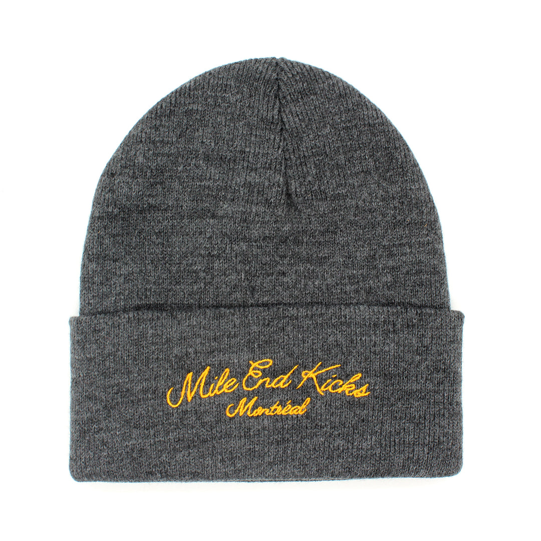 Gray beanie with yellow embroidered text on a white background