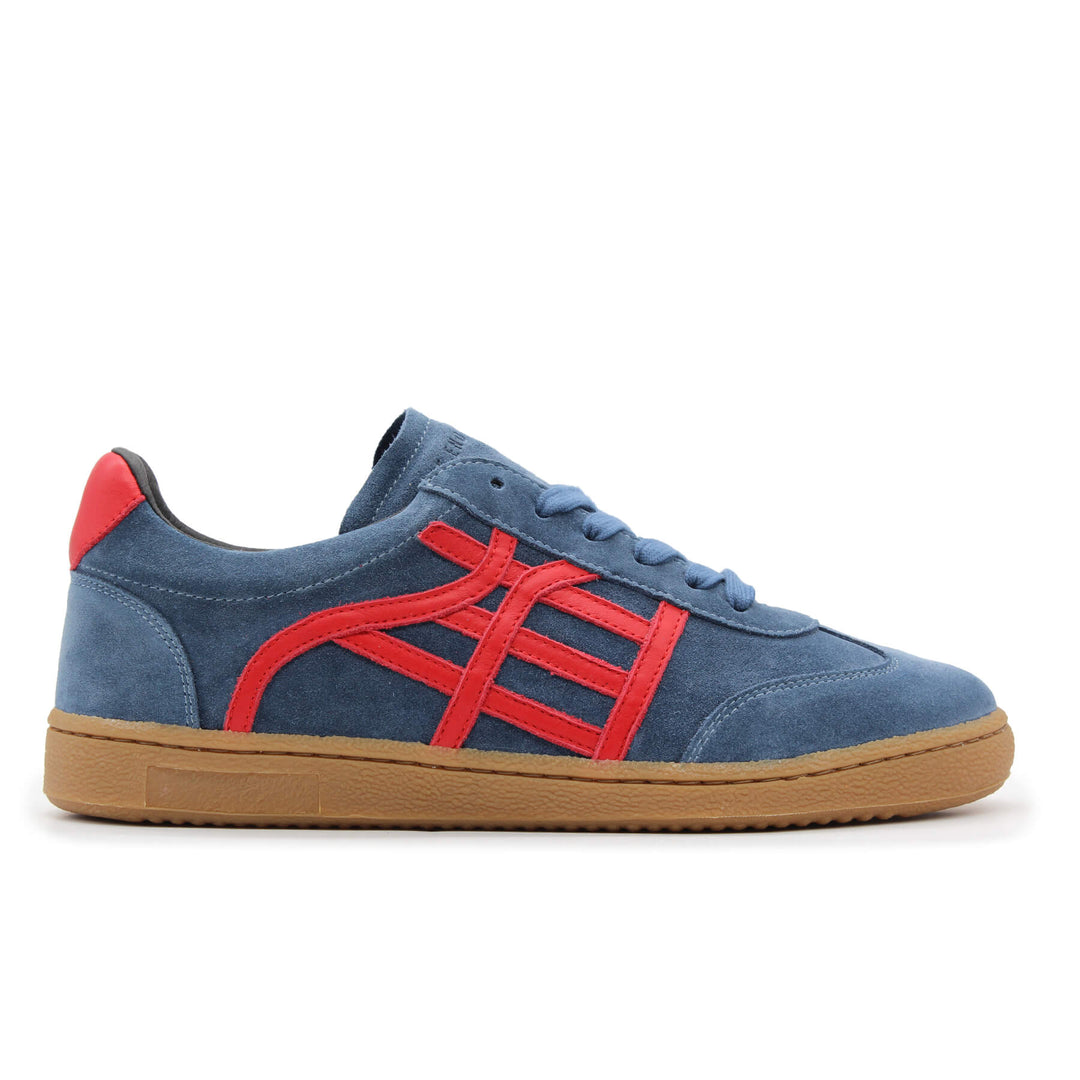 A navy and red sneaker with a gum sole.