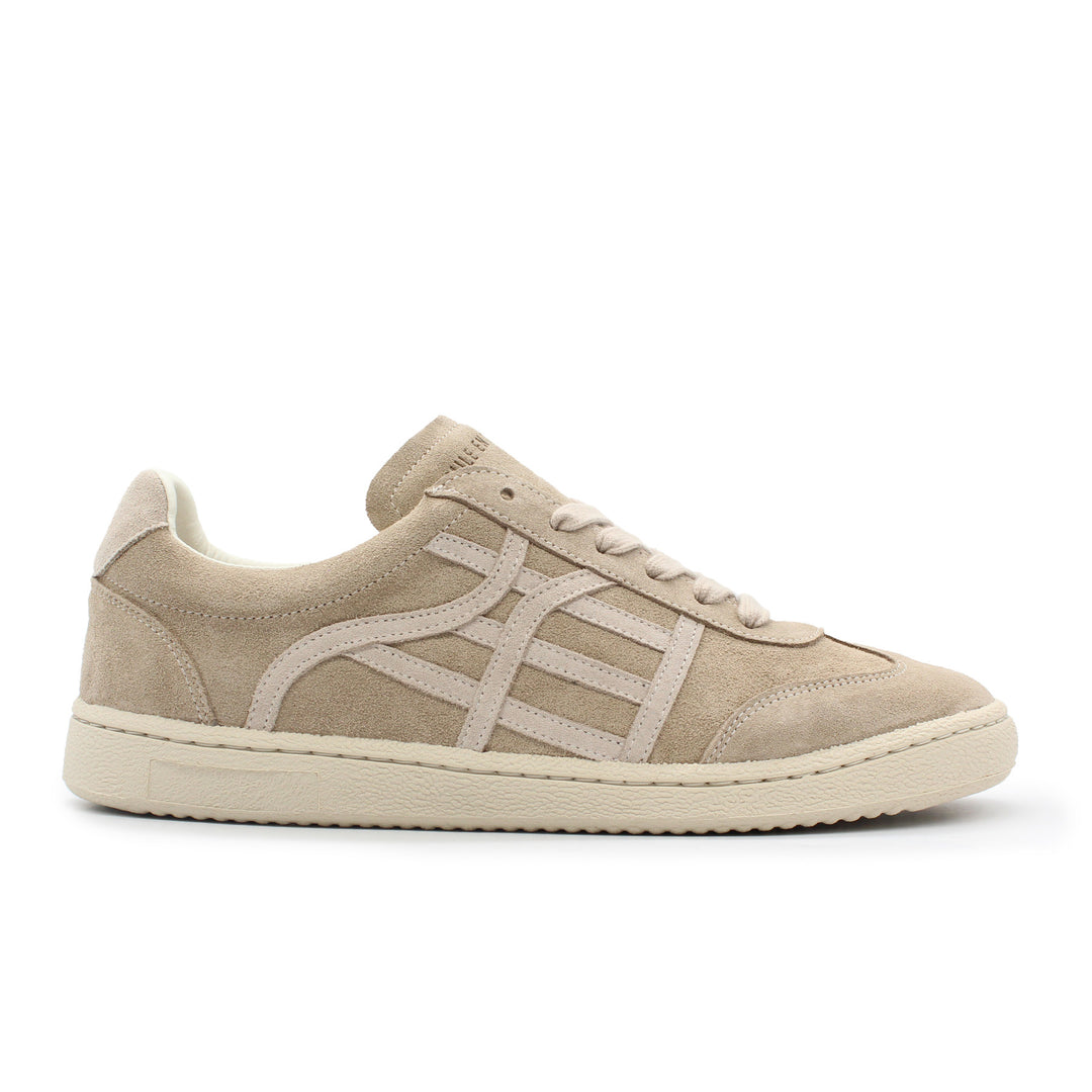 A light beige and cream sneaker with a cream sole.