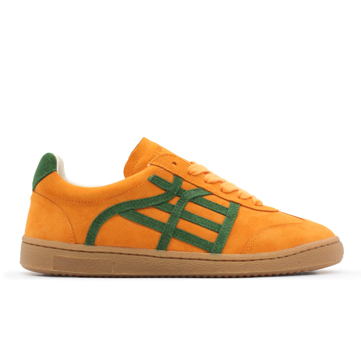 An orange and green suede sneaker with a gum sole.