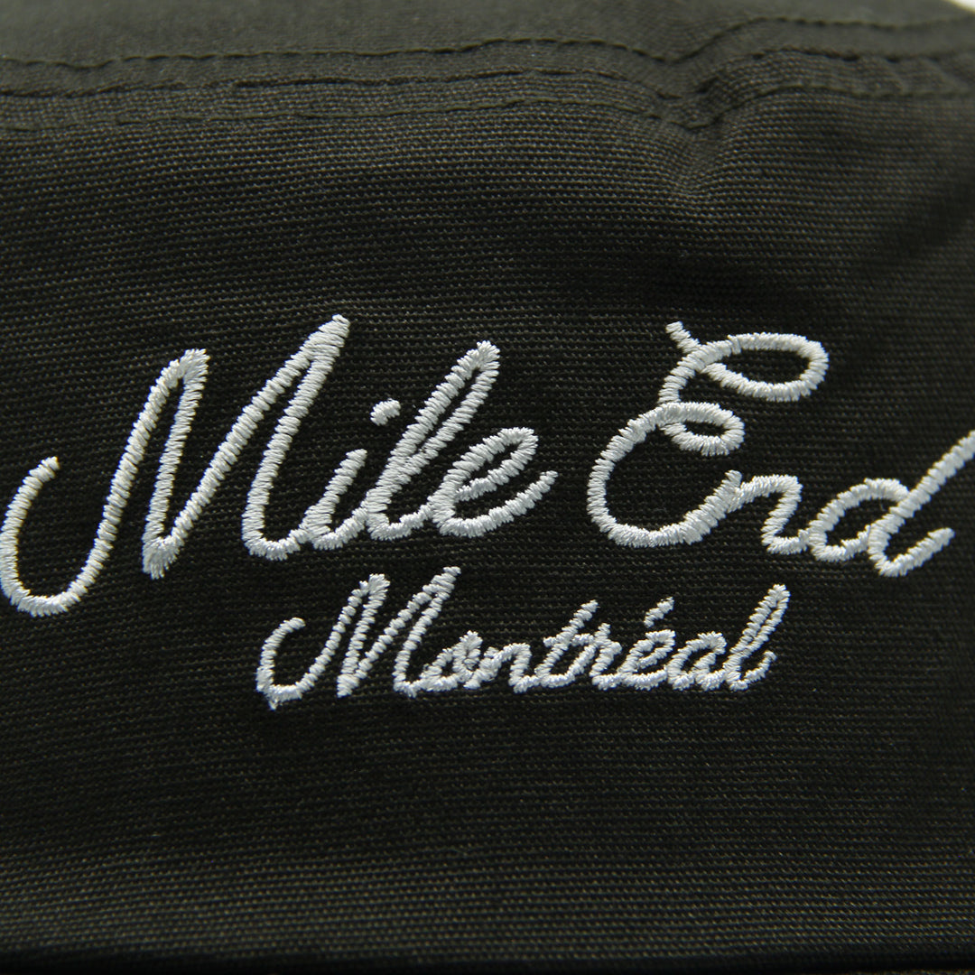 Green hat with 'Mile End Montreal' embroidered in white
