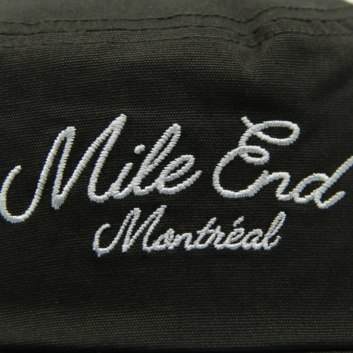 Green hat with 'Mile End Montreal' embroidered in white