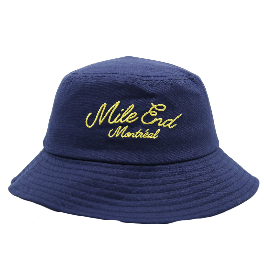 Navy blue bucket hat with yellow embroidered text on a white background