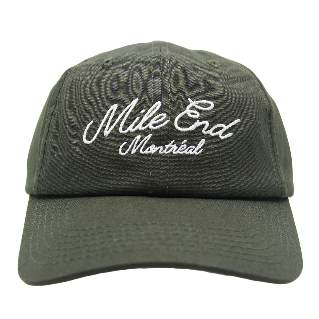 Green cap with 'Mile End Montreal' text on a white background