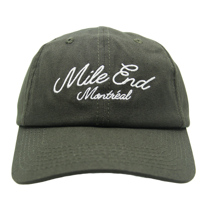 Green cap with 'Mile End Montreal' text on a white background