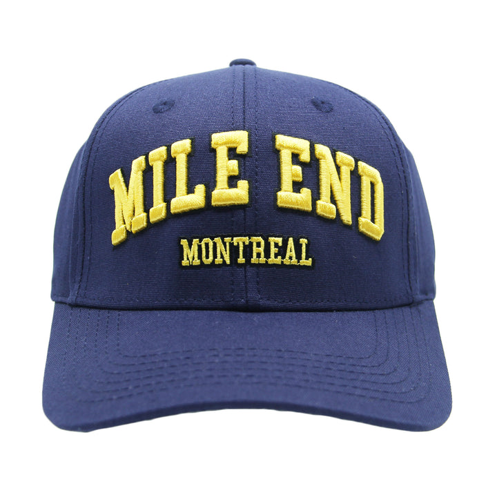 Blue cap with yellow text 'MILE END MONTREAL' on a white background