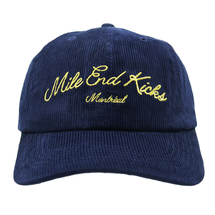 Navy blue cap with yellow embroidered text on a white background