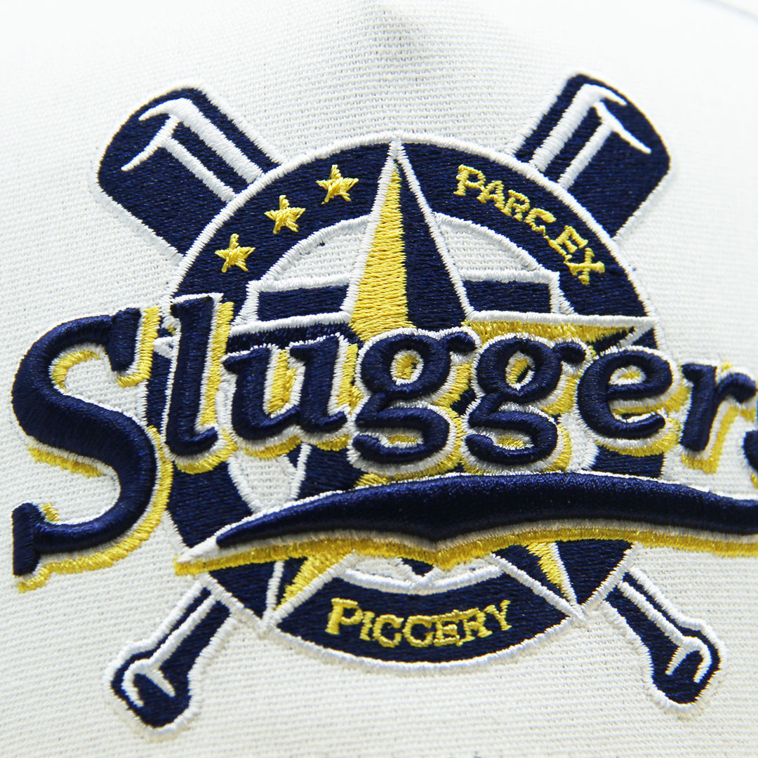 Embroidered logo with 'Sluggers' text on hat on a white background