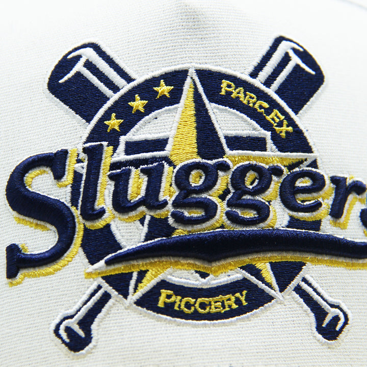 Embroidered logo with 'Sluggers' text on hat on a white background