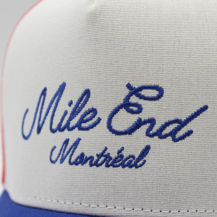 Trucker hat with 'Mile End Montreal' text on a white background