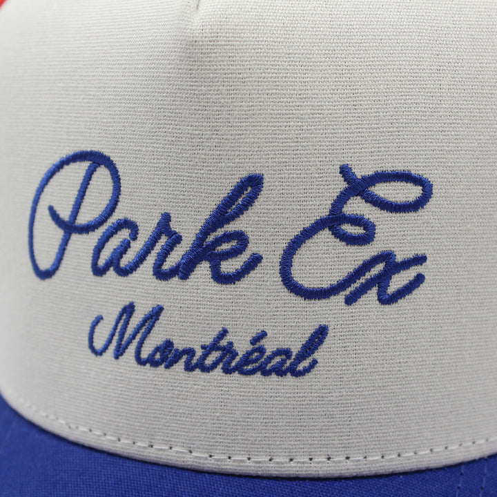 Close-up of a cap with 'Park Ex Montreal' embroidered on it.