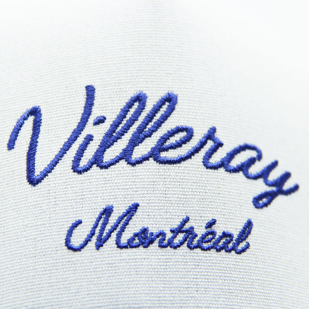 Embroidered text 'Villeray Montréal' on a cap on a white background
