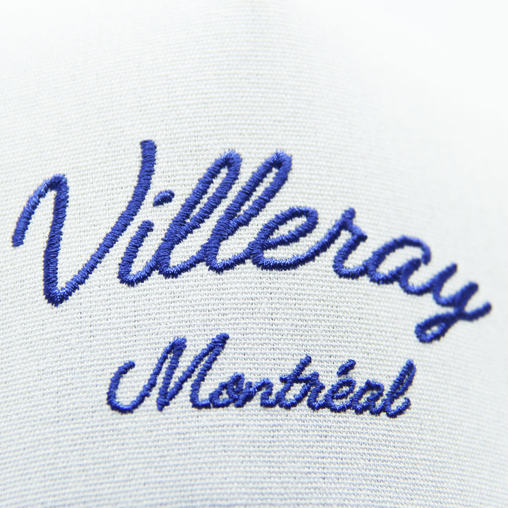 Embroidered text 'Villeray Montréal' on a cap on a white background