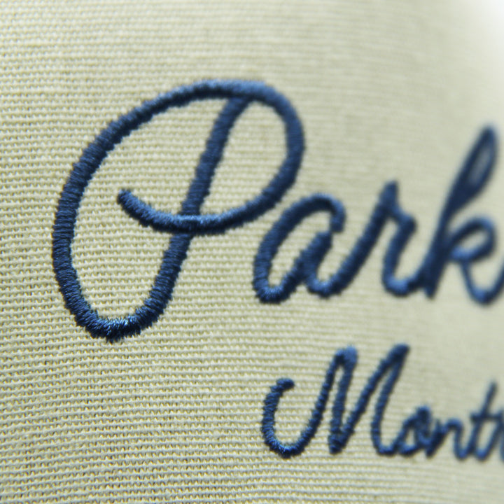 Embroidered text 'Park Ex Montreal' on a cap on a white background