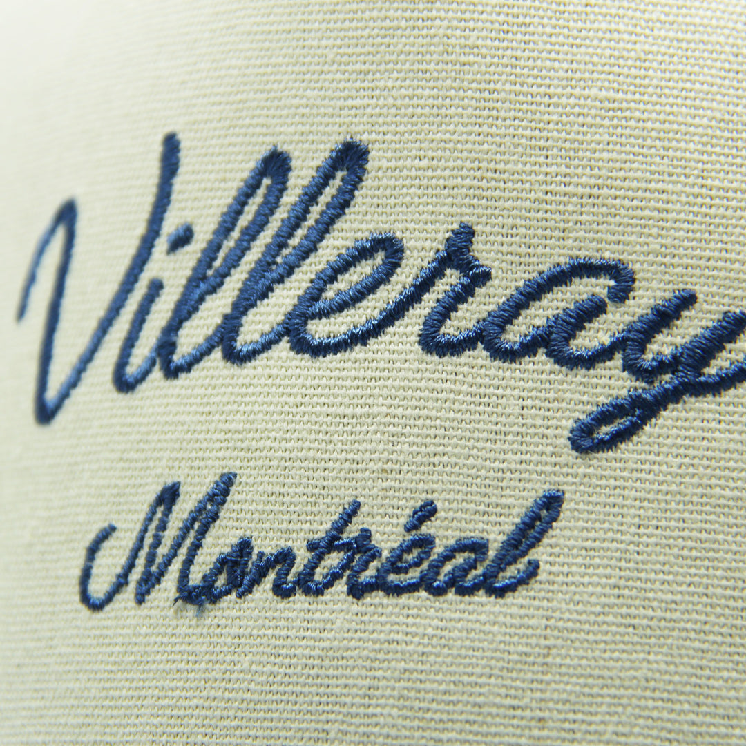 Embroidered text 'Villeray Montreal' on a cap on a white background