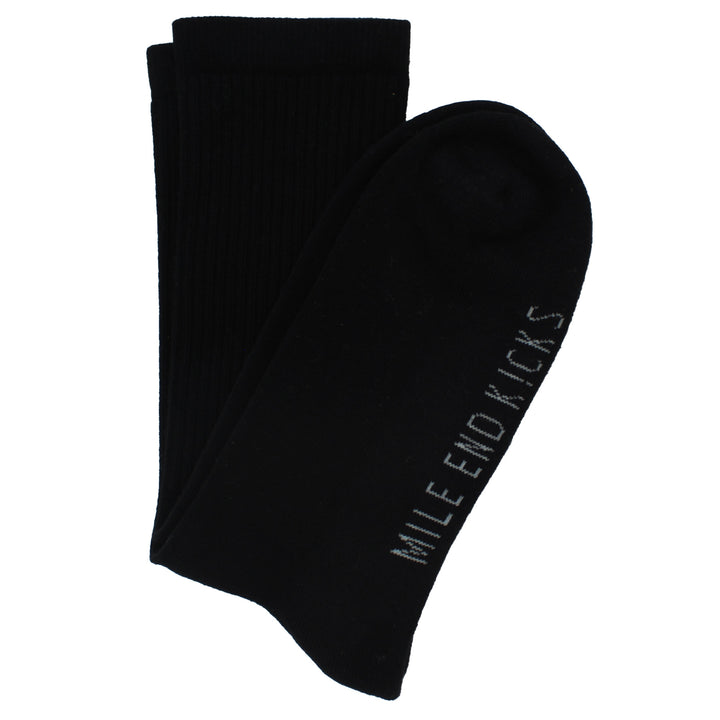 Black socks with 'Mile End Kicks' branding on a white background