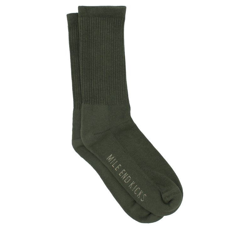 Green sock with 'Mile End Kicks' branding on a white background