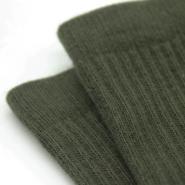 Two green socks on a white background