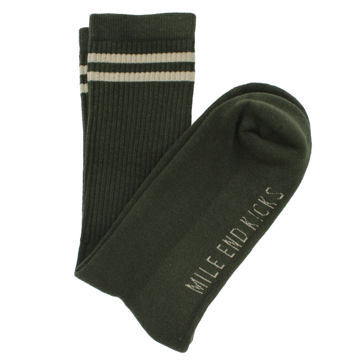 Green socks with a logo on a white background