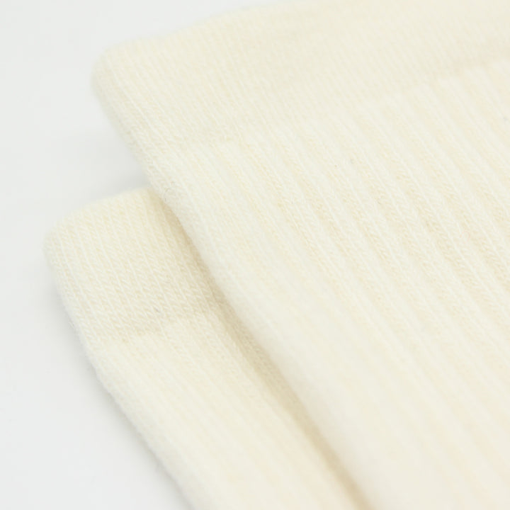 Close-up of a beige socks on a white background