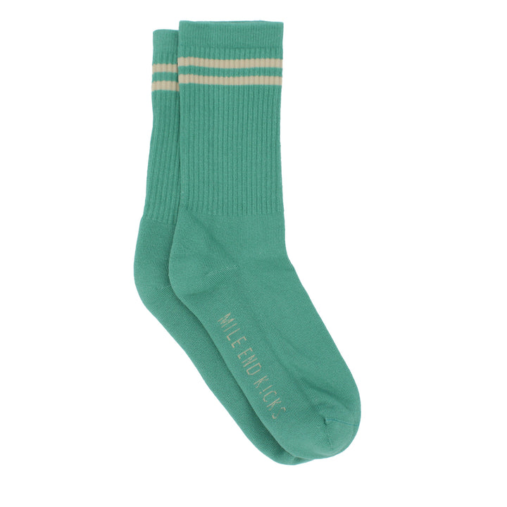 Green sock with two stripes on a white background