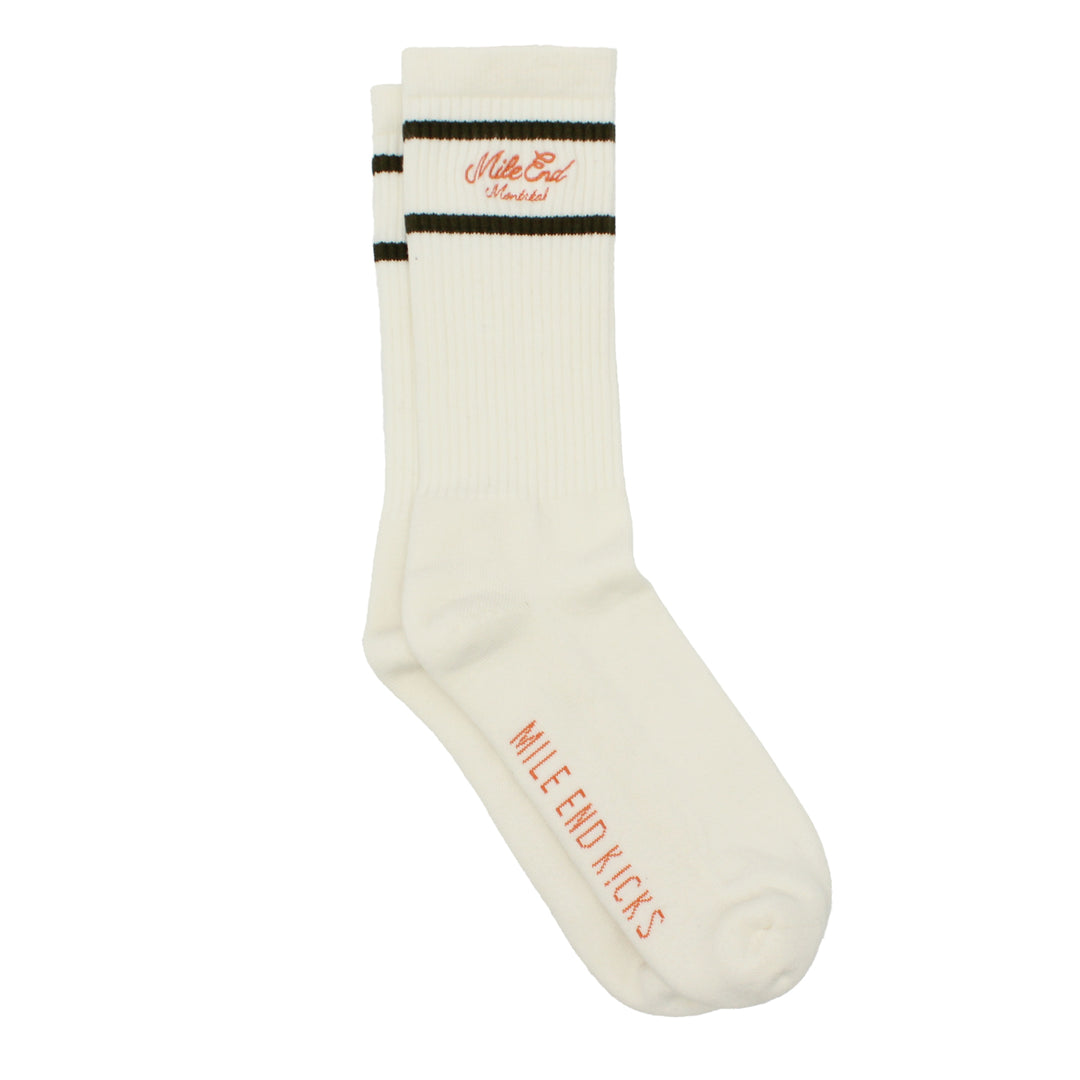 White sock with green and orange text on a white background