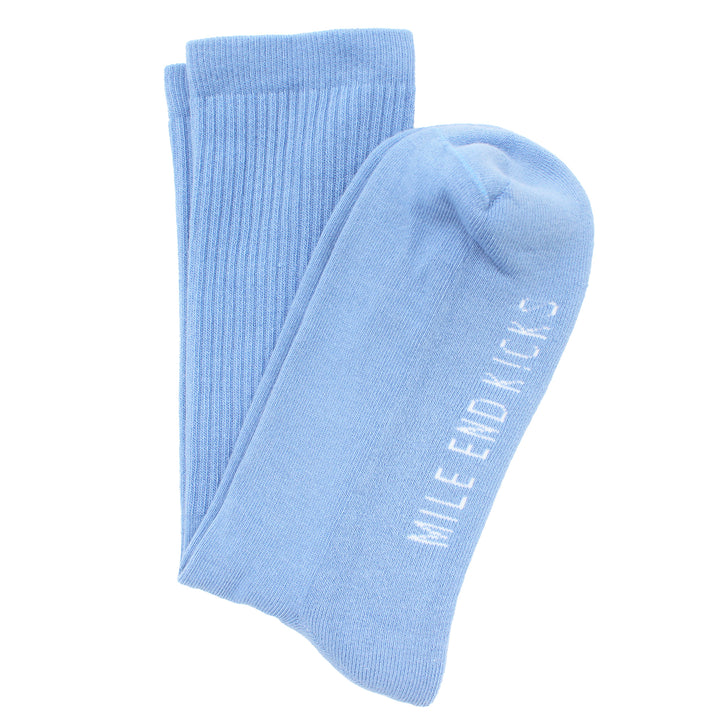 Light blue socks with 'Mile End Kicks' text on a white background