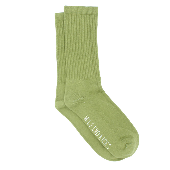 Green sock with 'Mile End Kicks' branding on a white background