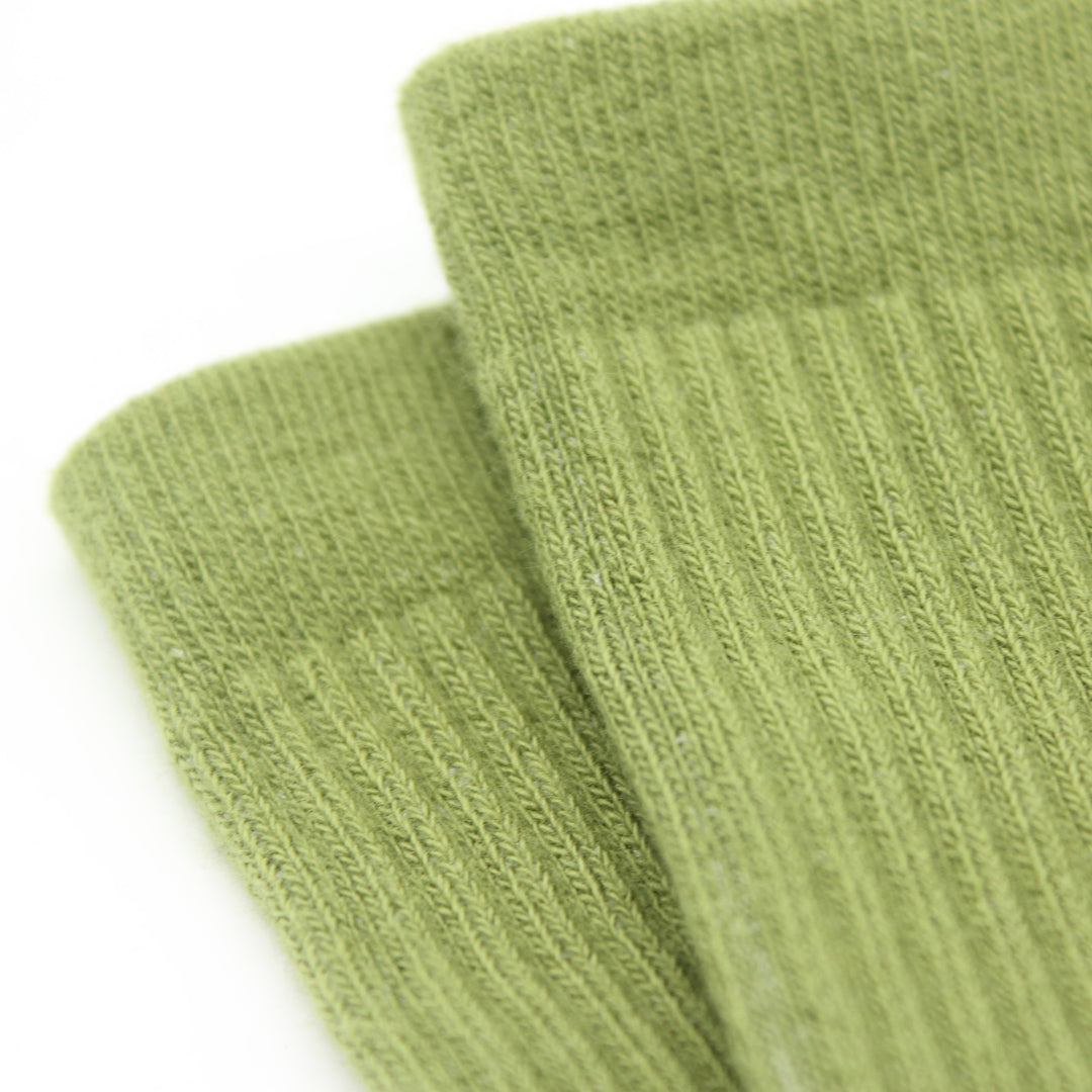 Two green socks on a white background