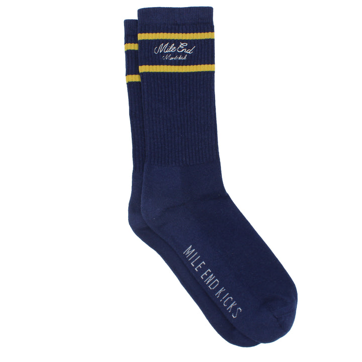 Navy blue sock with yellow stripes and branding on a white background
