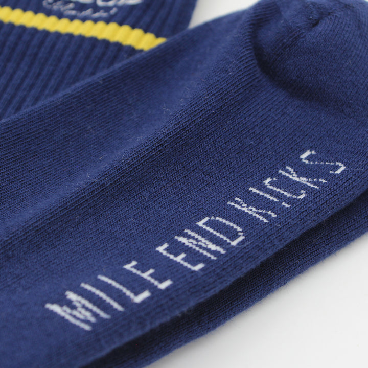Navy blue socks with 'Mile End Kicks' branding on a white background