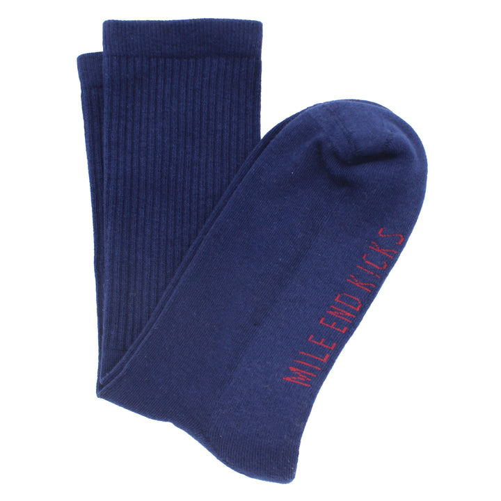 Pair of blue socks with 'Mile End Kicks' text on a white background