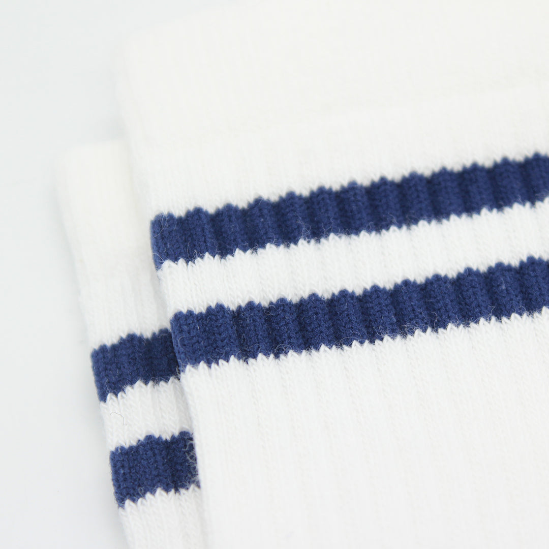 Close-up of a white socks with blue stripes on a white background