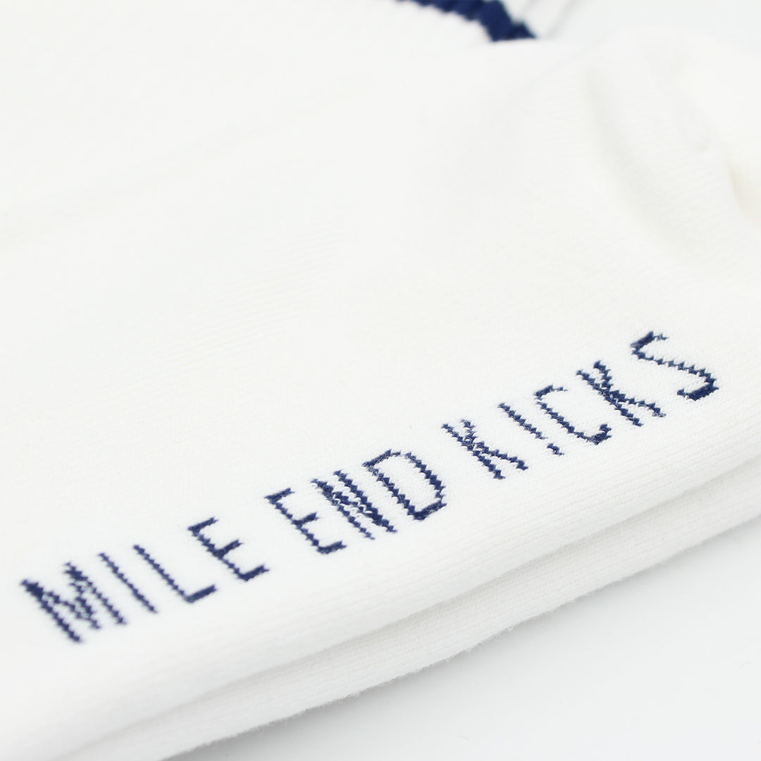 White sock with 'MILE END KICKS' text in blue on a white background