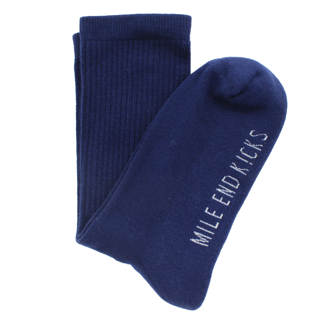 Pair of navy blue socks with 'Mile End Kicks' branding on a white background
