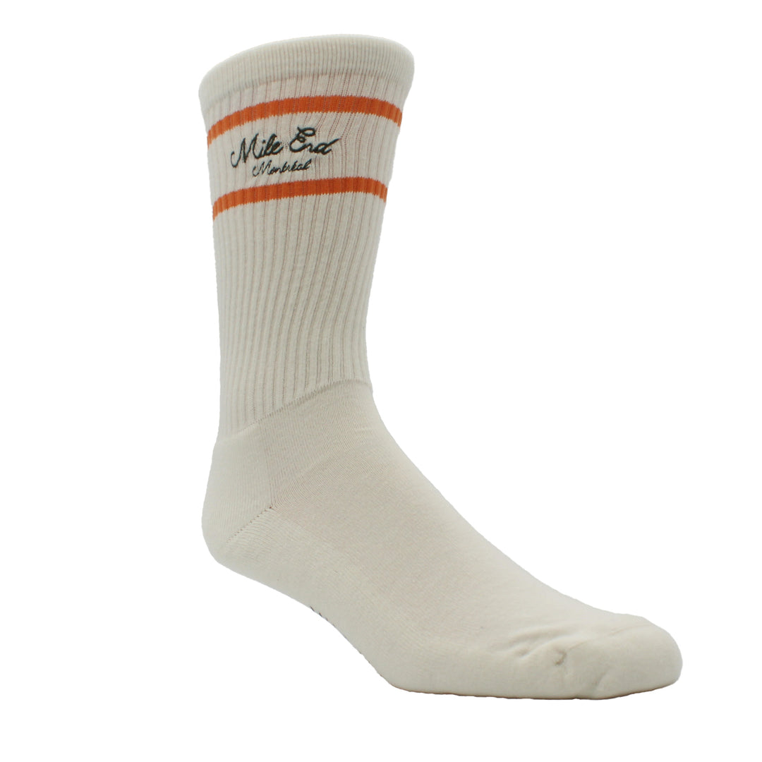 White sock with orange stripe and branding on a white background
