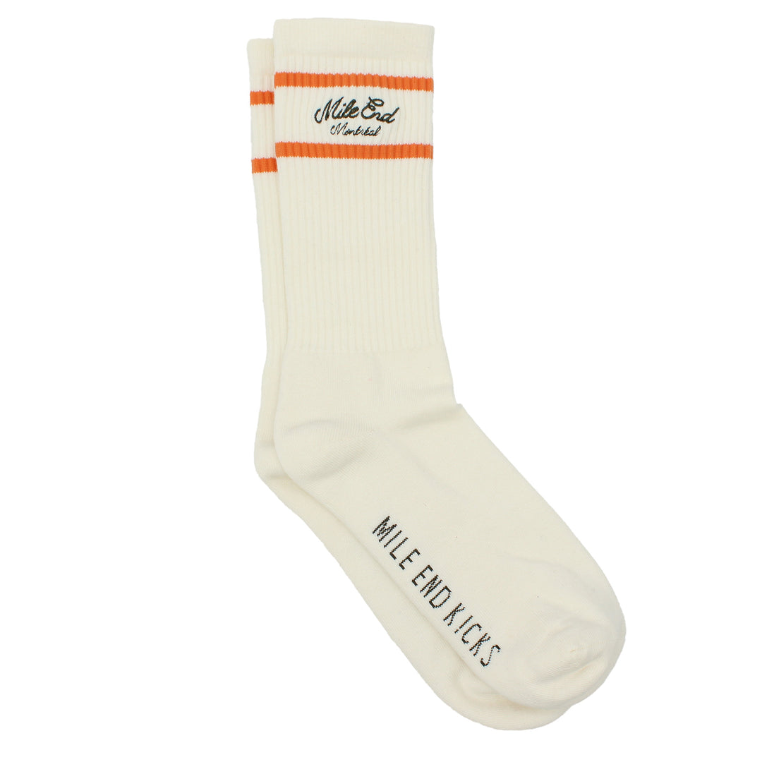 White sock with orange and black text on a white background