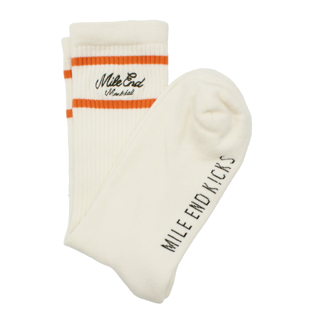 White socks with orange stripe and text on a white background