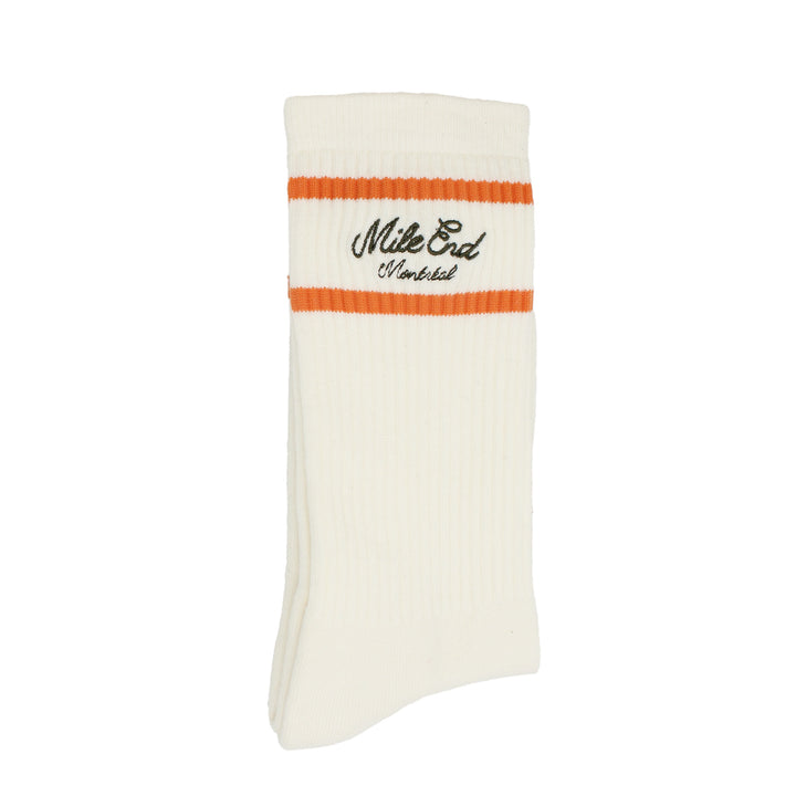 White sock with orange band and black text on a white background