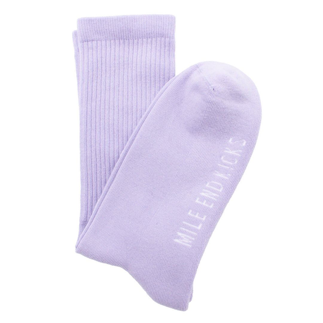 Pair of light purple socks with 'Mile End Kicks' text on a white background
